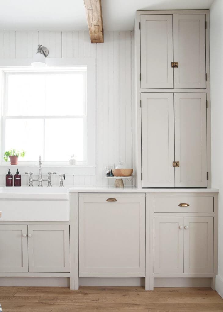 white kitchen with paneled dishwasher