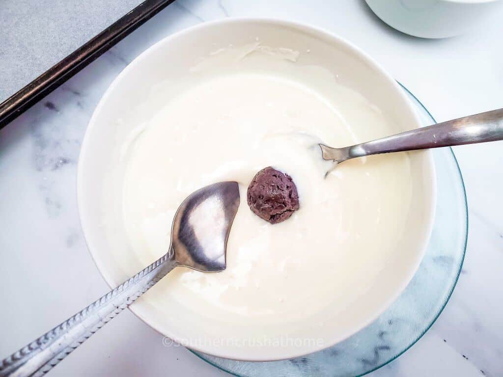 rolling oreo balls in chocolate