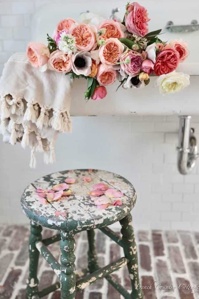 Old stool with spring flowers