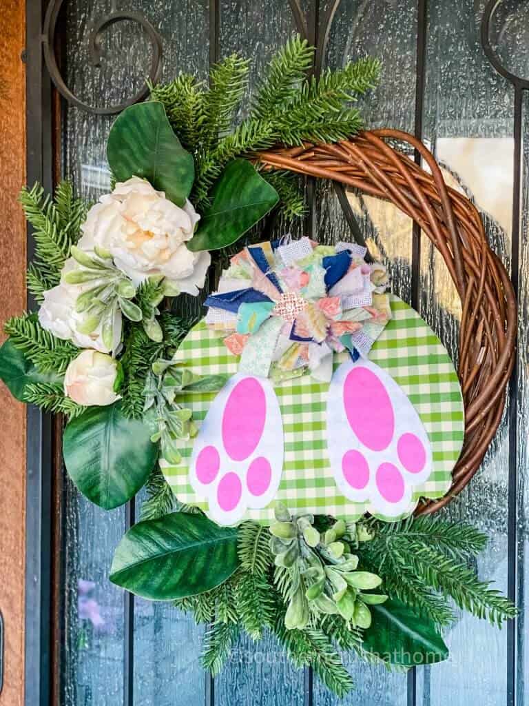 close up of bunny butt Easter wreath on front door