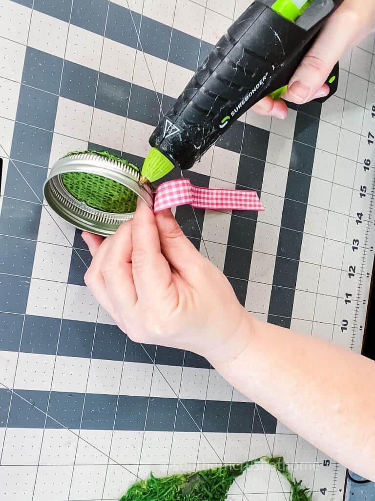 adding ribbon to mason jar lid