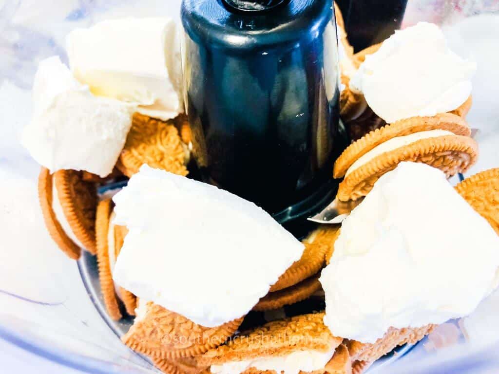 adding cream cheese to food processor