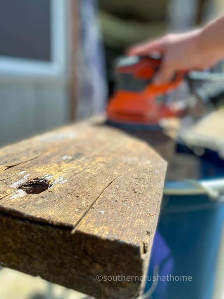 sanding wood for tree swing