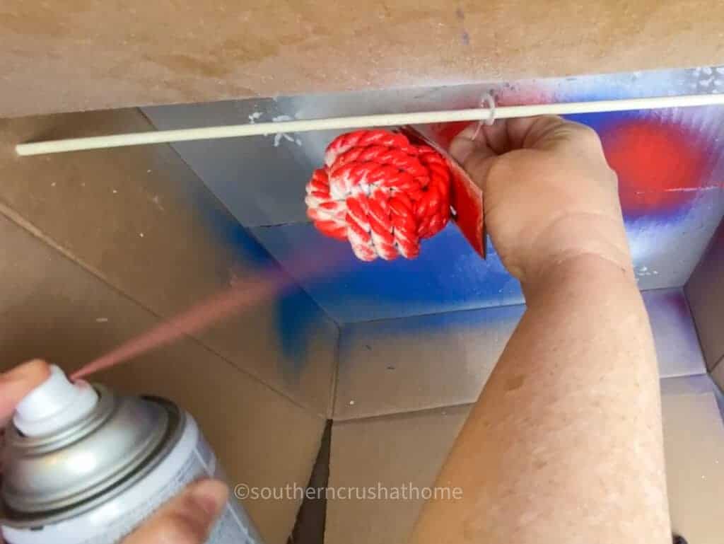 spraying decorative ball red