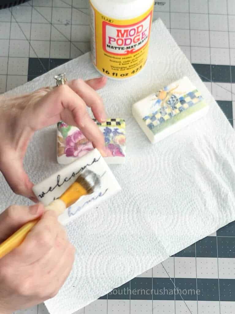 brushing mod podge on soap