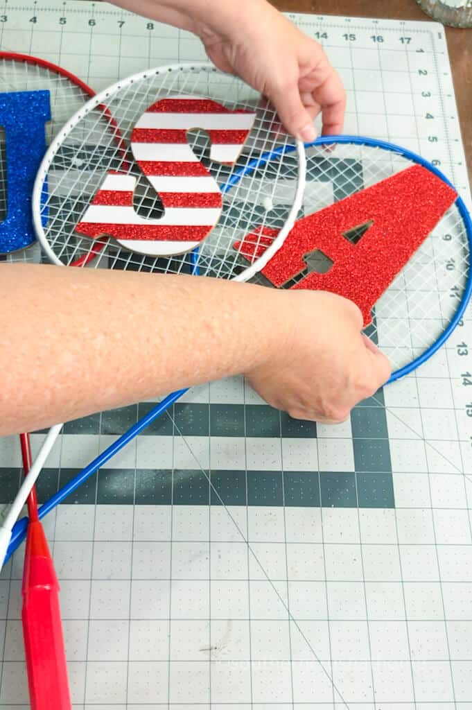 gluing letters onto rackets