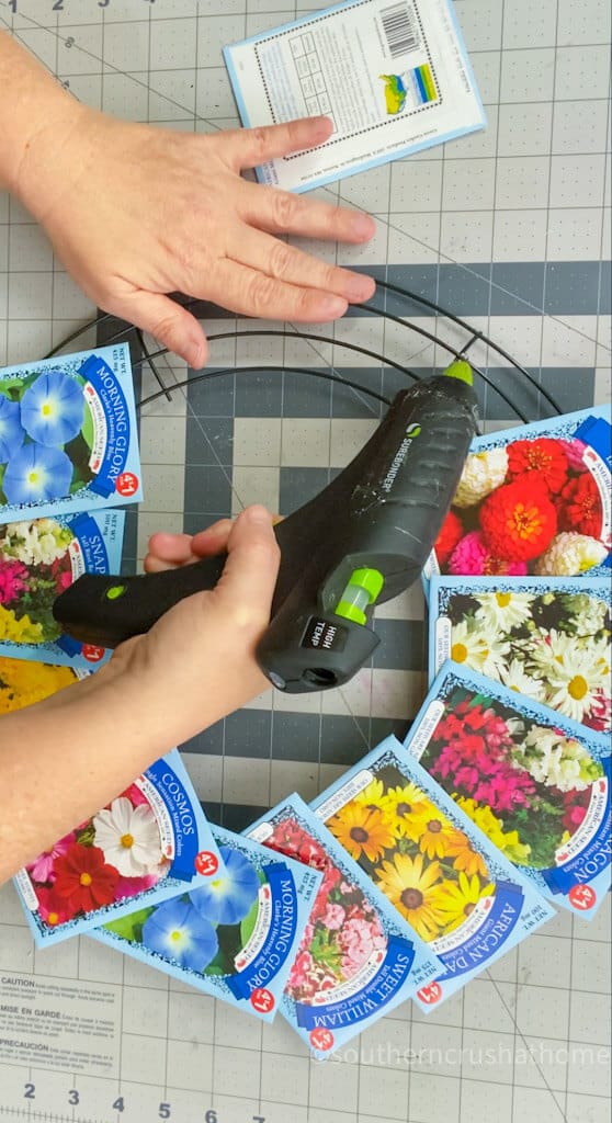 gluing seed packets to wreath form