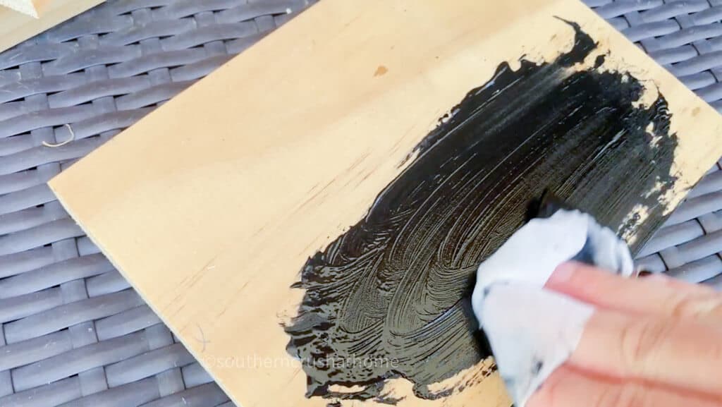 adding black paint to wood