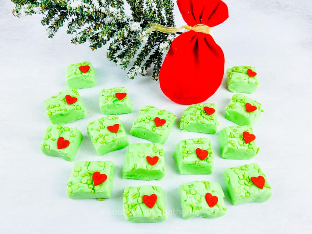 Grinch fudge laid out on counter with Grinch Tree