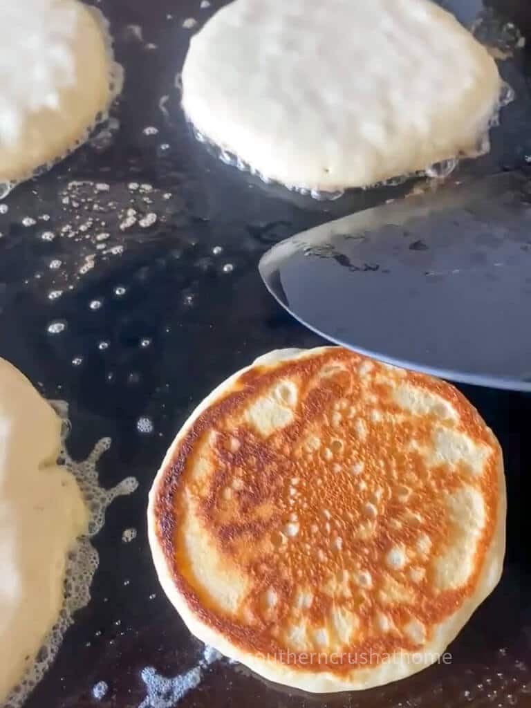 golden pancake on griddle