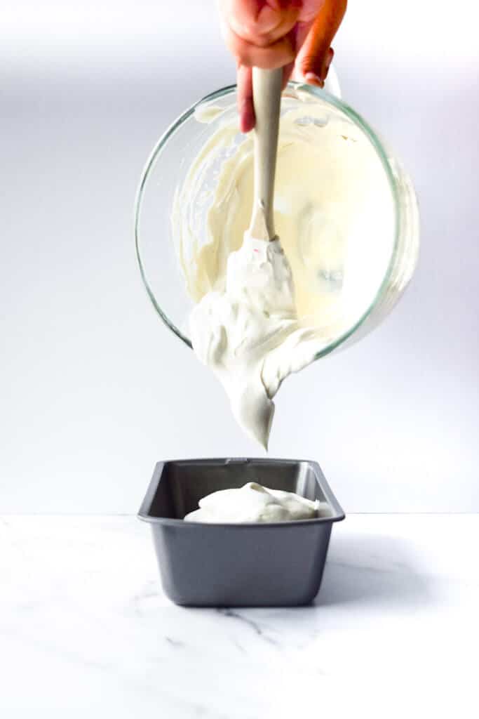 pouring old-fashioned homemade vanilla ice cream into loaf pan