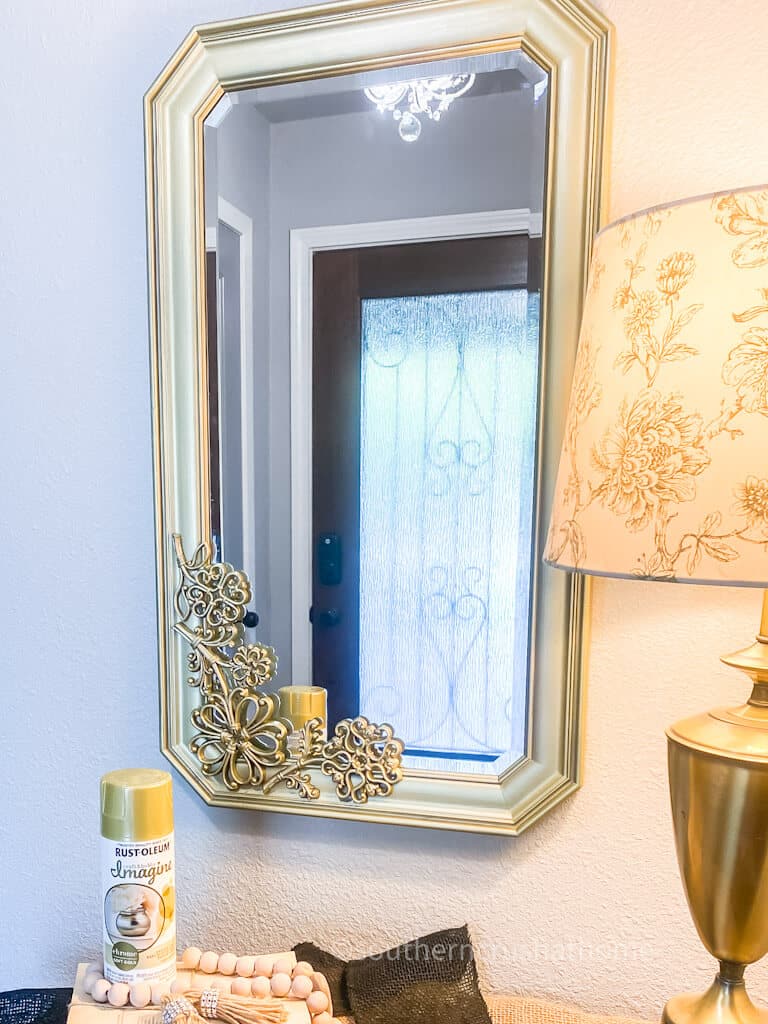 gold mirror hung on wall