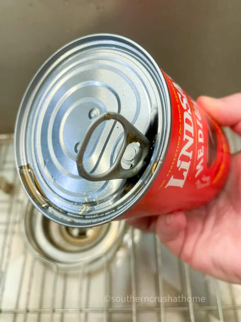 draining olives from can
