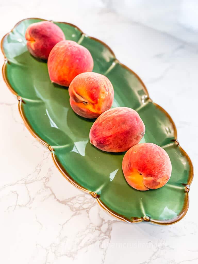 fresh peaches on a platter