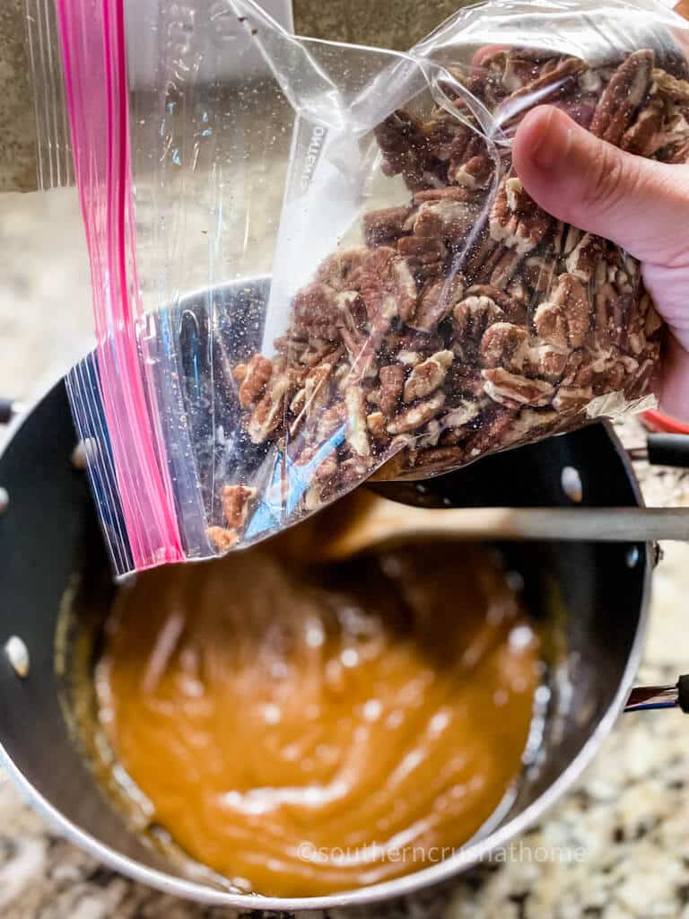 adding pecans to praline mixture