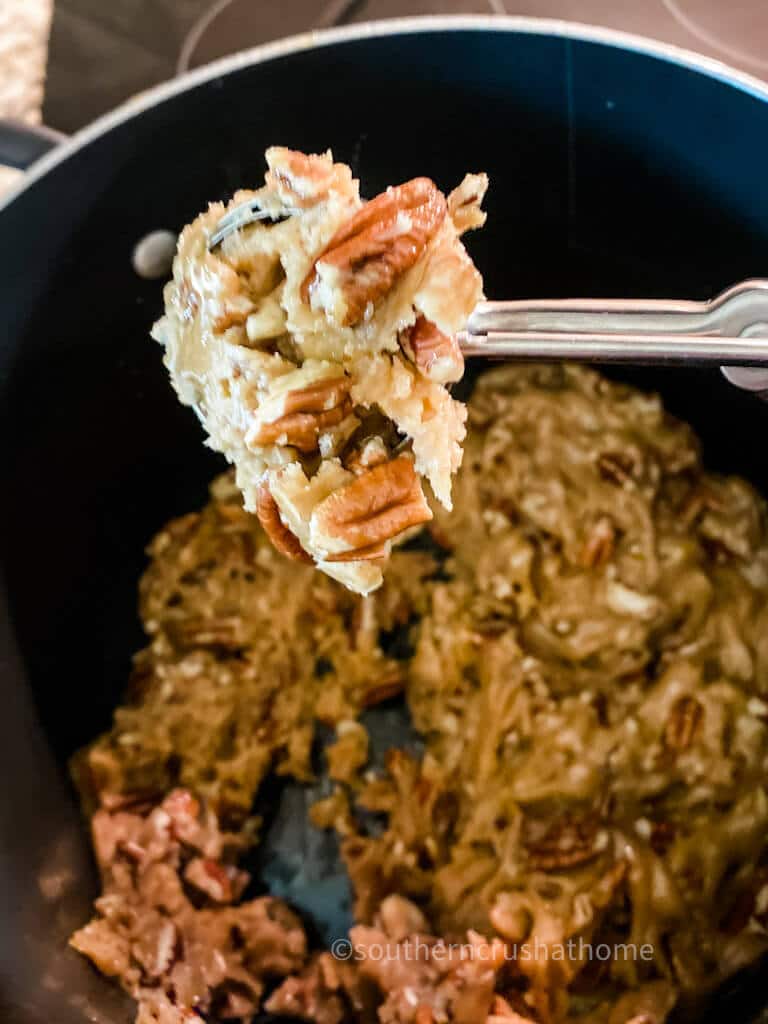 candied pecans on spoon