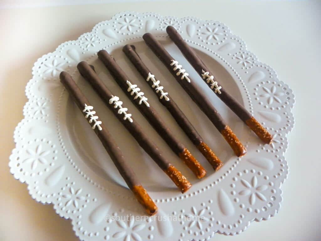 chocolate covered pretzel rods with football stripes