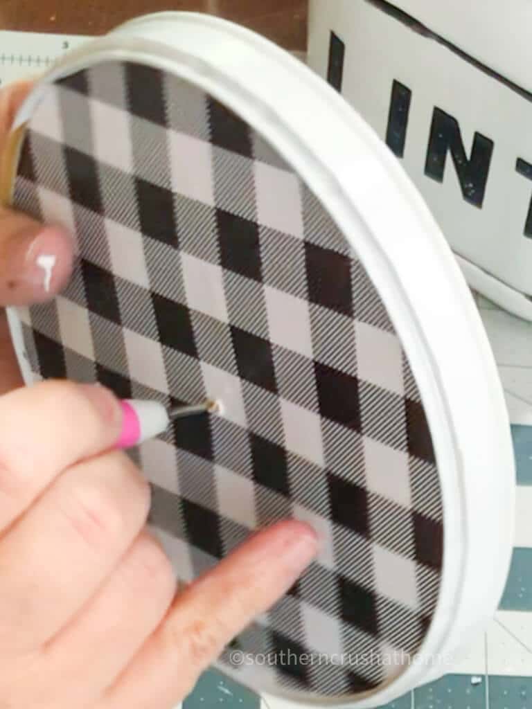 poking a hole through lid