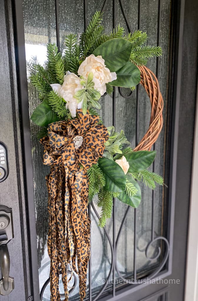 leopard wreath bow hanging on wreath