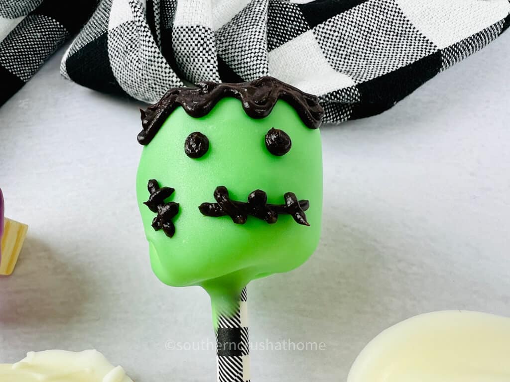 close up of frankenstein chocolate covered marshmallow