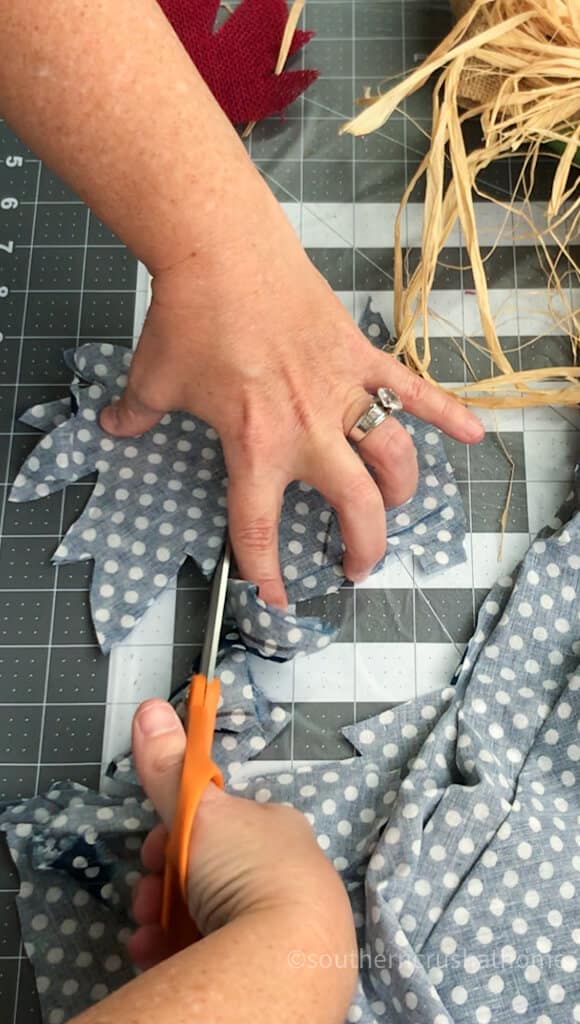 cutting fabric leaves