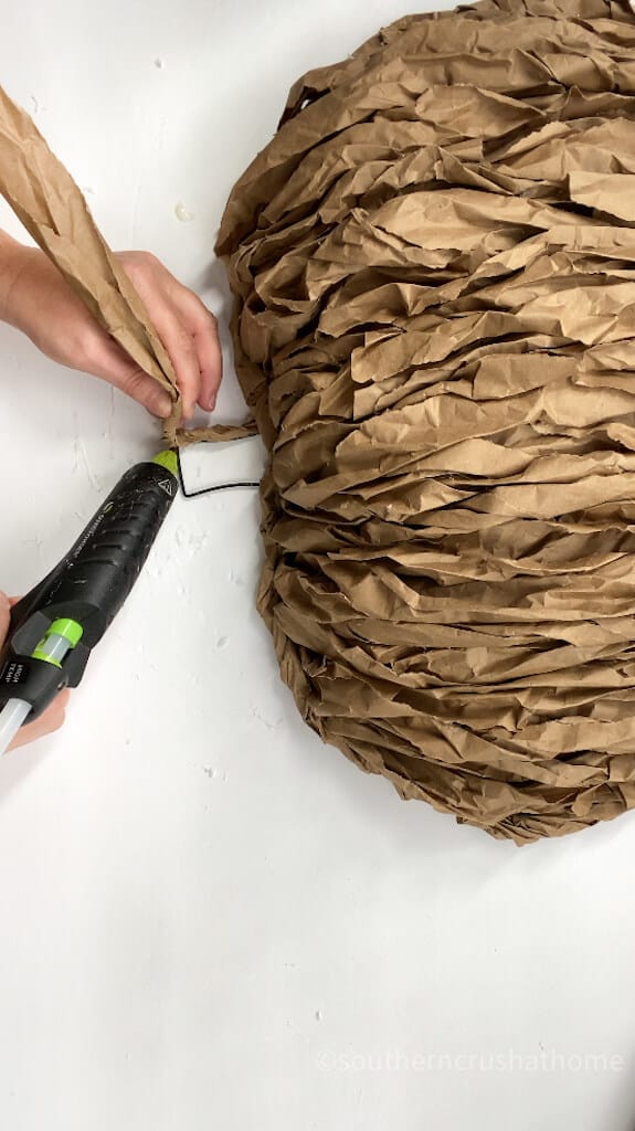 adding kraft paper to stem of pumpkin