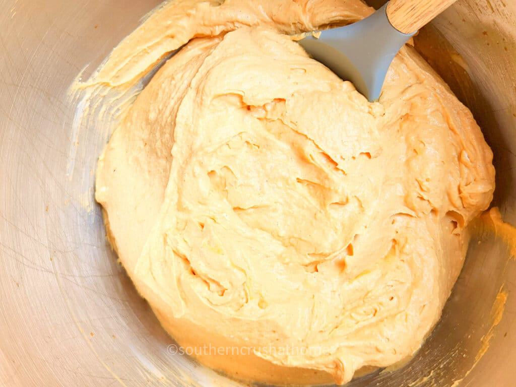 stirring pumpkin pie cheesecake