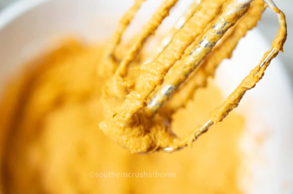 close up of pumpkin dip on beaters