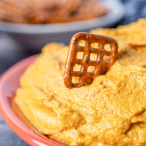 close up of pretzel in pumpkin fluff dip