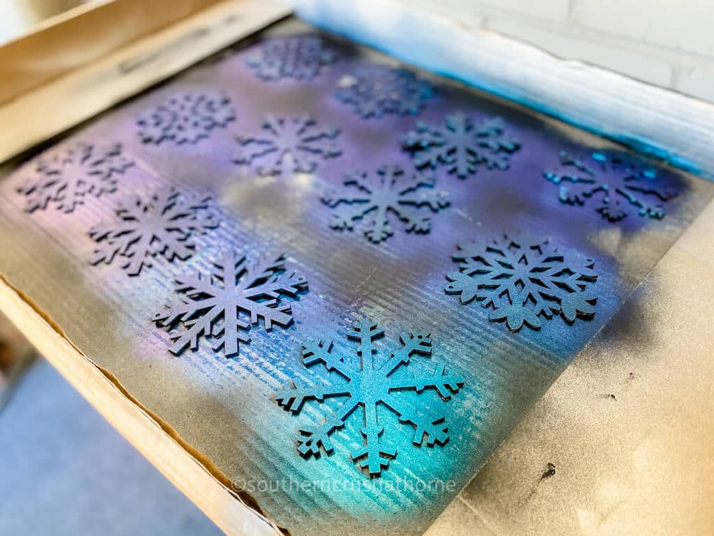 spray painted turquiose snowflakes