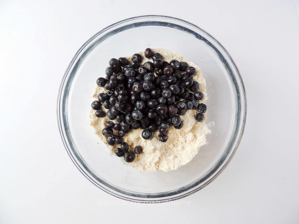 fresh blueberries on top of dry ingredients