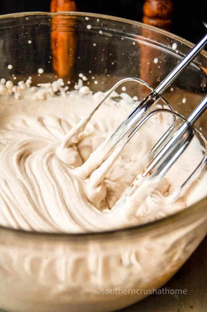 beaters beating cinnamon whipped cream