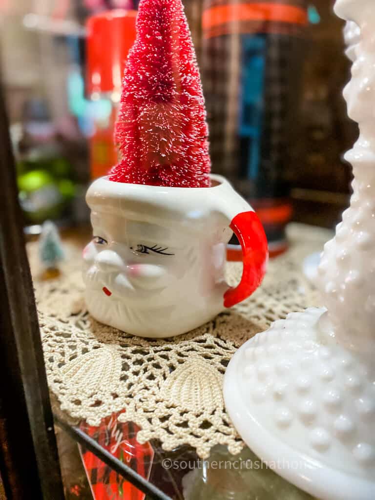 vintage santa mug on display in china cabinet