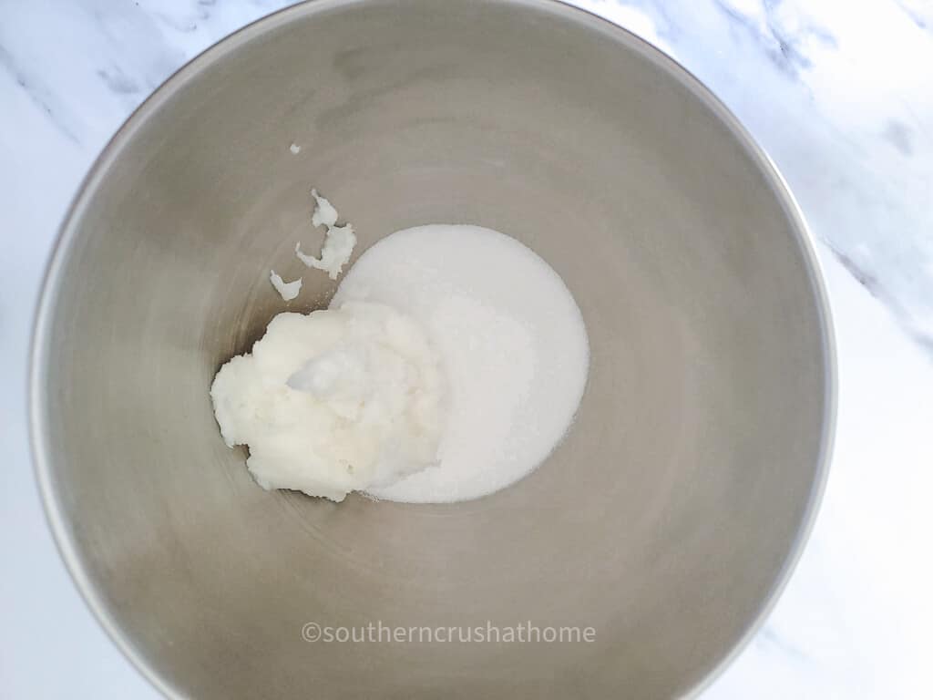 adding sugar scrub ingredients to mixing bowl