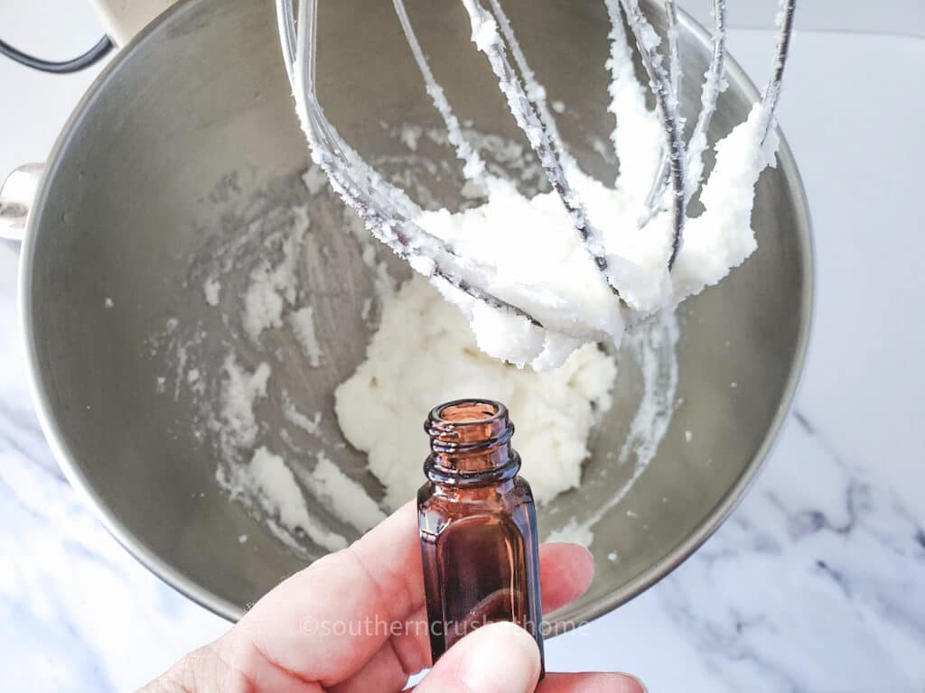 adding essential oil to sugar scrub