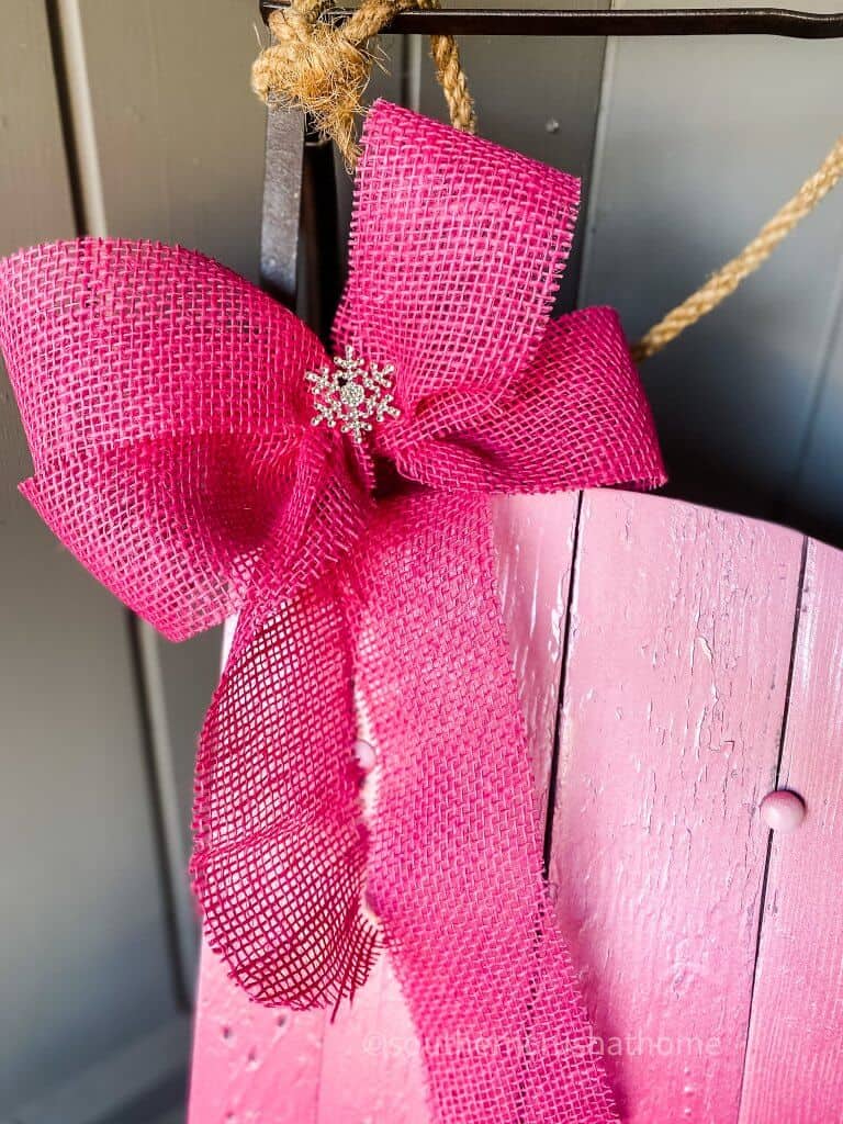 close up of pink burlap bow