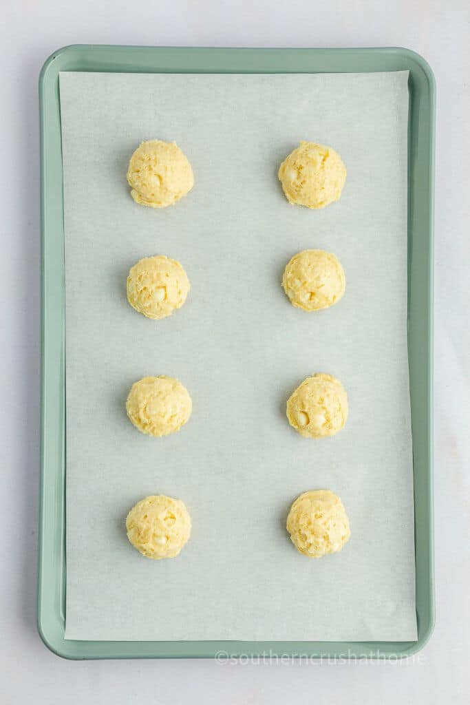 cookie balls on baking sheet