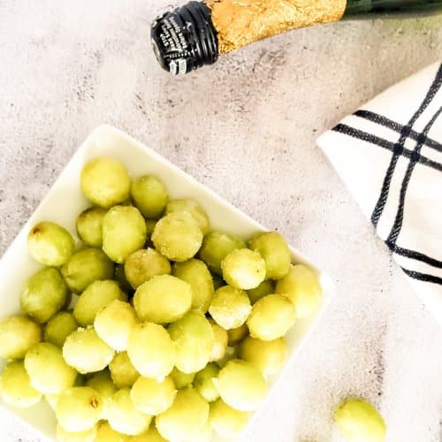 view of champagne grapes with bottle