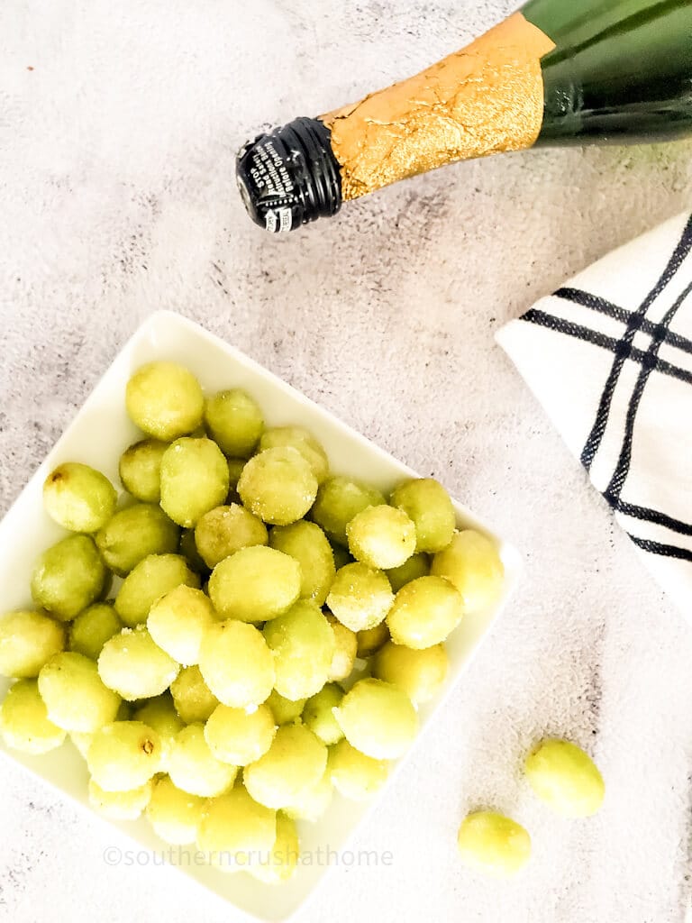 view of champagne grapes with bottle