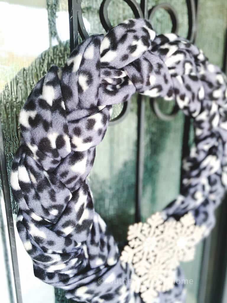 close up view of braided scarves on wreath