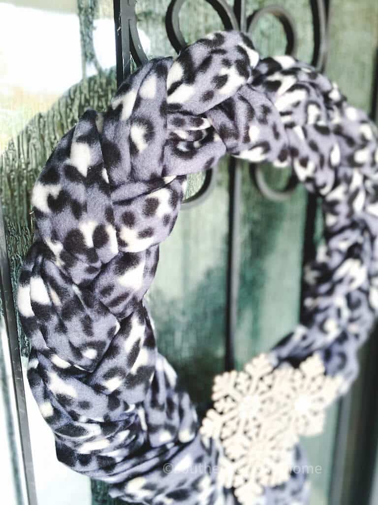 close up view of braided scarves on wreath