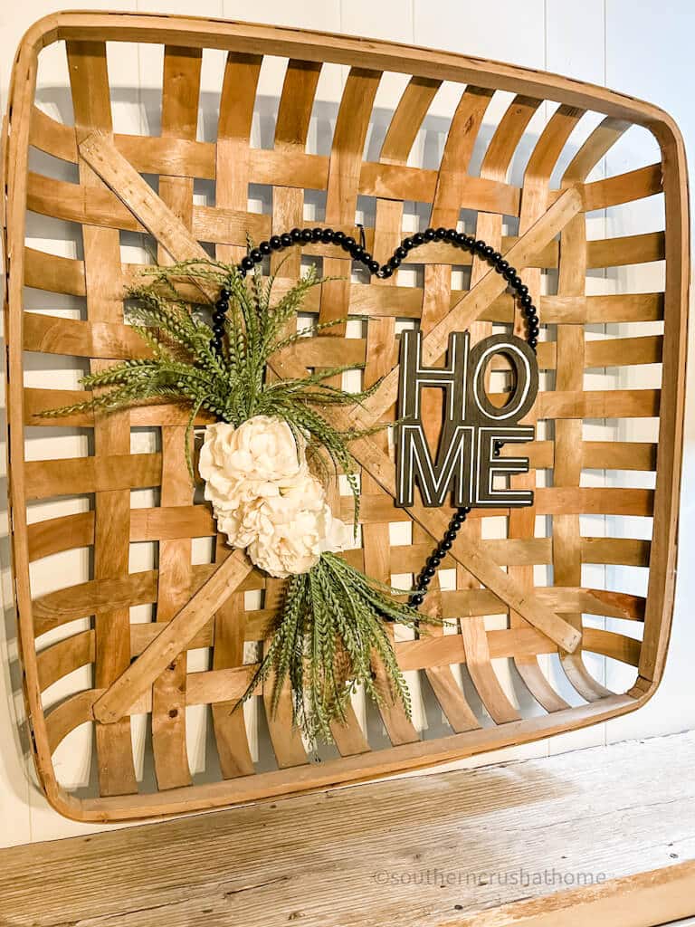 dollar tree wood bead heart wreath in tobacco basket