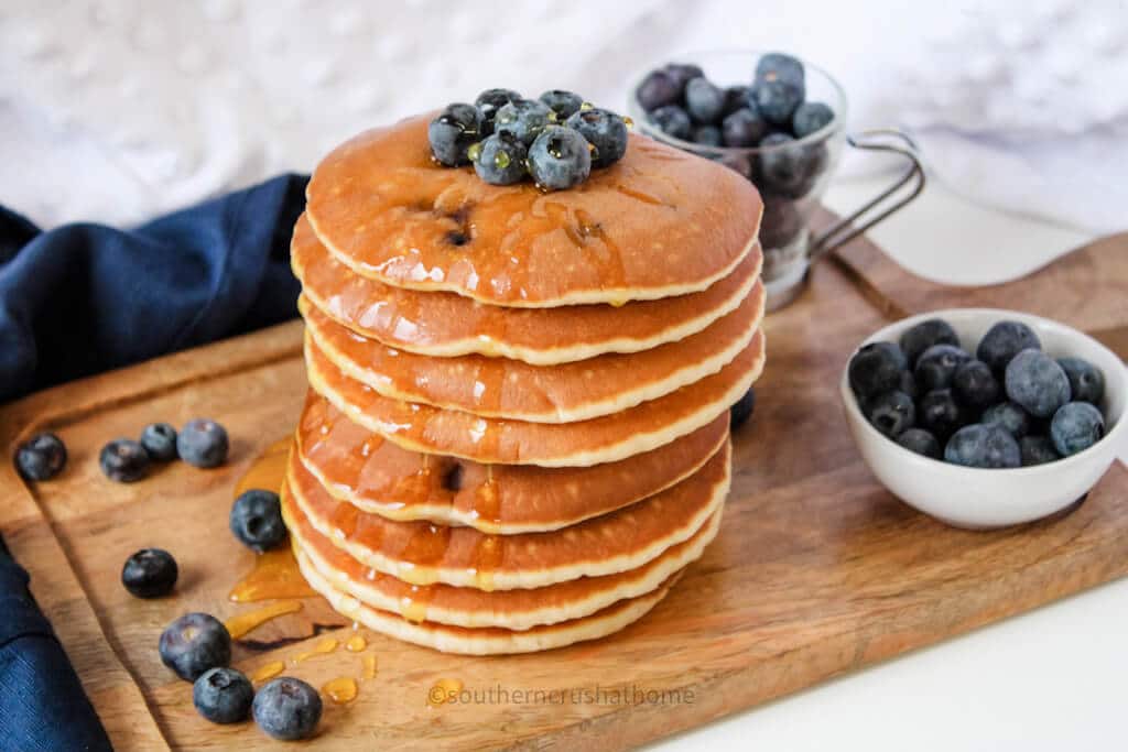 stack of eggless pancakes on cutting board
