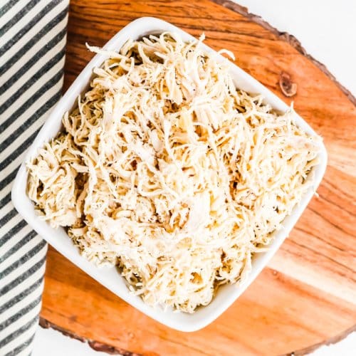 overhead view of bowl of shredded chicken