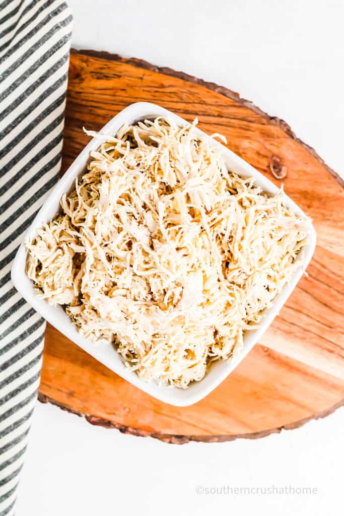 overhead view of bowl of shredded chicken