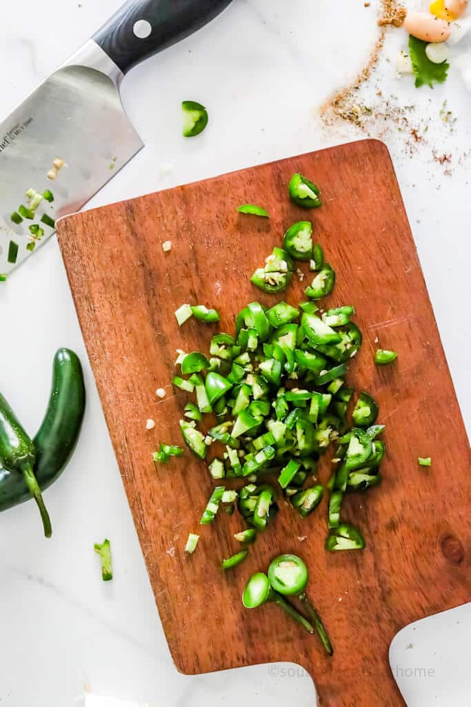 chopped jalapenos on cutting board