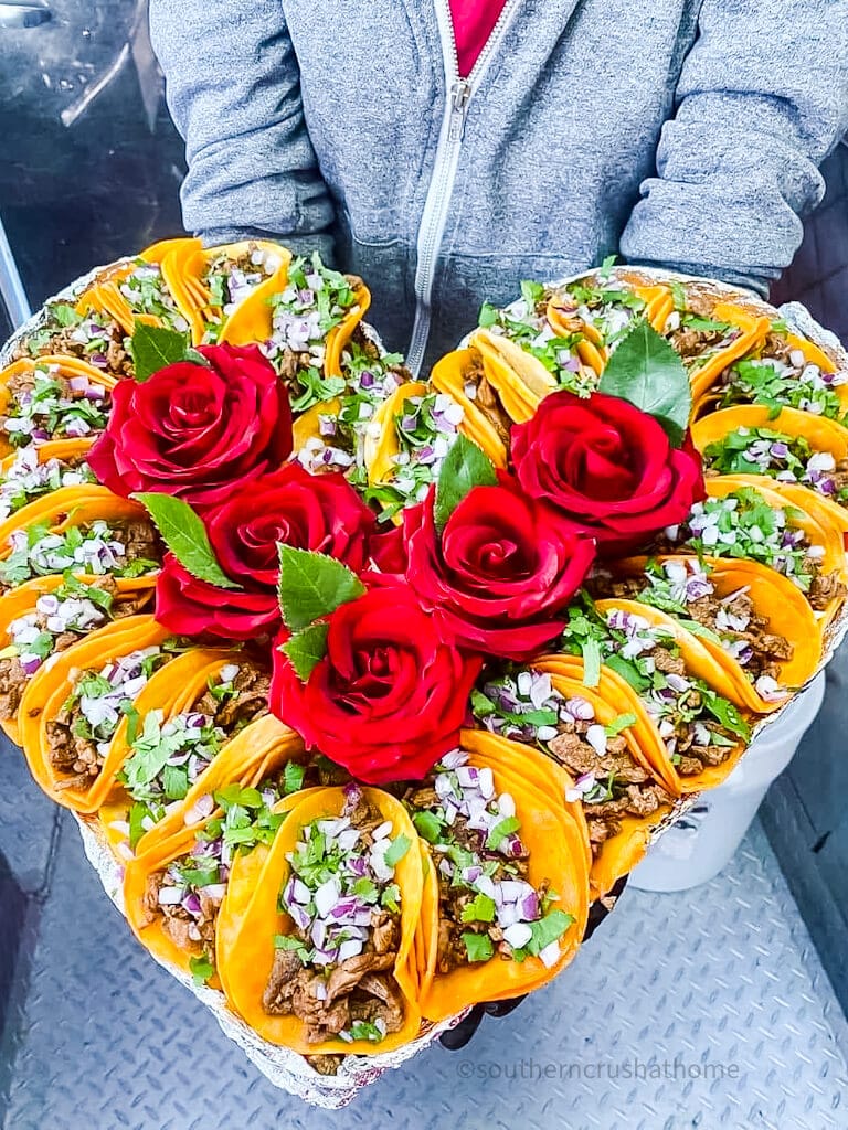 heart shaped tray of tacos with roses