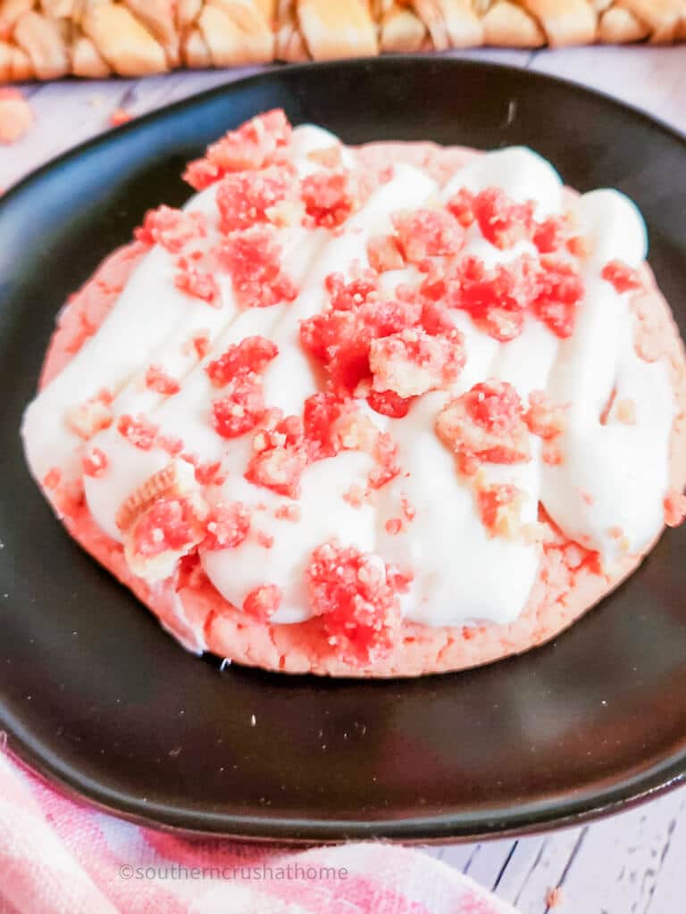 up close view of copycat crumbl strawberry crunch cookie