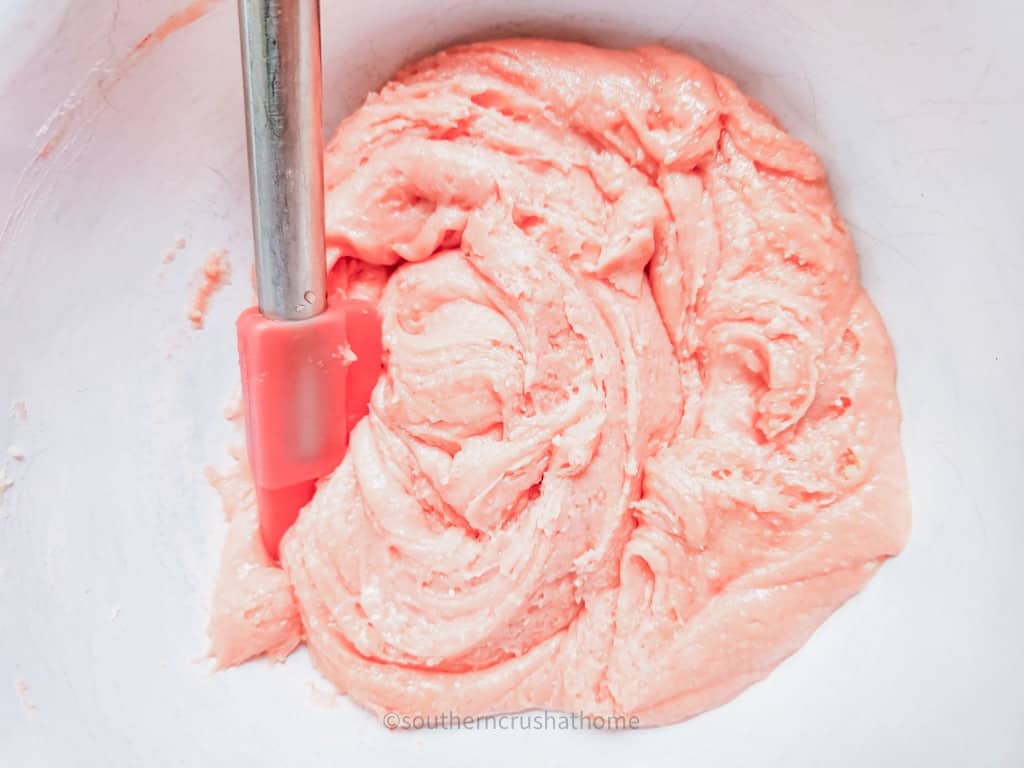 mixing strawberry cake batter