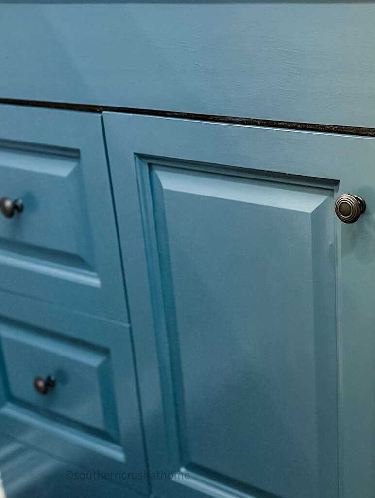 up close view of painted bathroom cabinet fronts